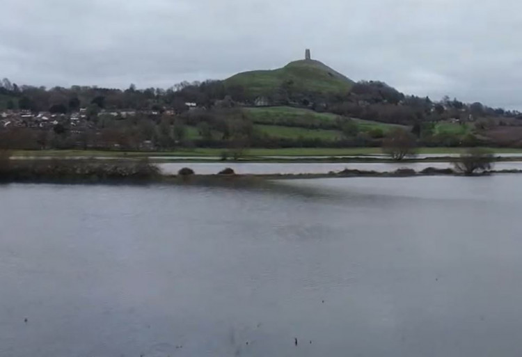 Drone footage by YouTuber JustMadnessBoy reveals extensive flooding in fields between Street and Glastonbury caused by Storm Bert.