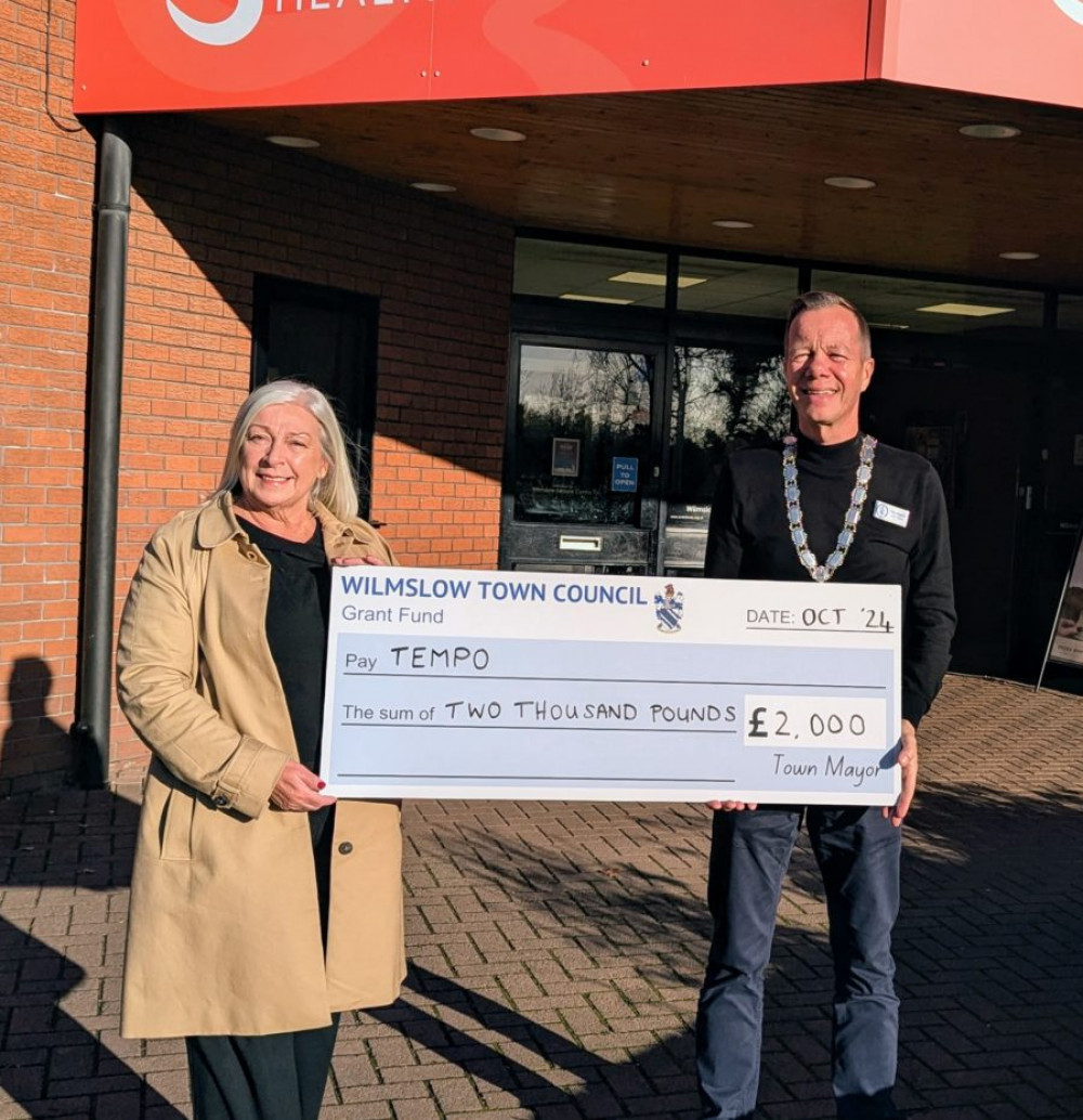 Wilmslow Town Mayor, Cllr Tim Higgins handing over a cheque for £2000 to Lynn Ashall from TEMPO (Wilmslow Town Council).