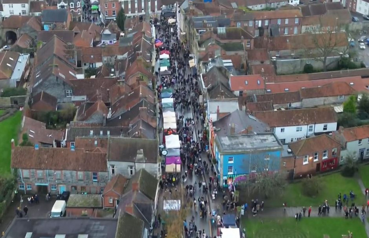 Crowds pour into Glastonbury High Street as the Frost Fayre gets underway. 