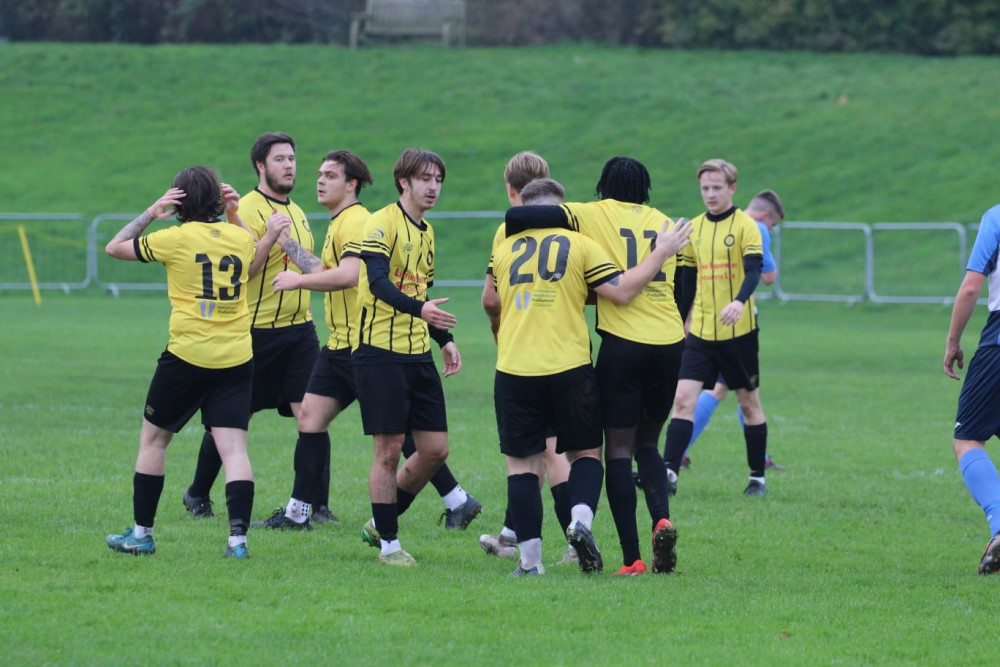 Young Rocks celebrate a goal. 