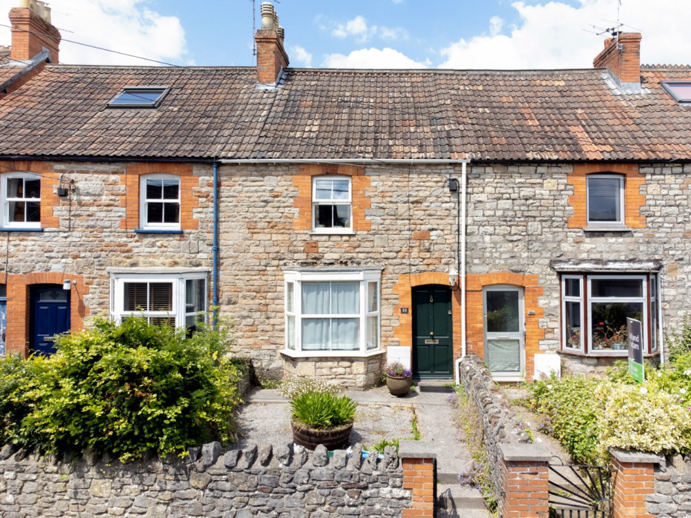 A two-bedroom Victorian terrace on North Road, Wells, with a picturesque garden and just steps from the city centre.