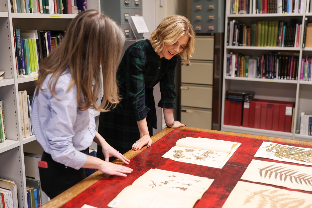 Marie-Hélène Weech, Lead Digitisation Operations Management, for Kew Gardnes (left) joined Emilia Fox as they digitised plant specimens (credit:  Chris Jackson/Getty Images for RBG Kew).