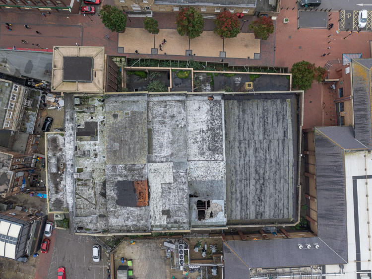 An aerial shot shows the state of the State roof