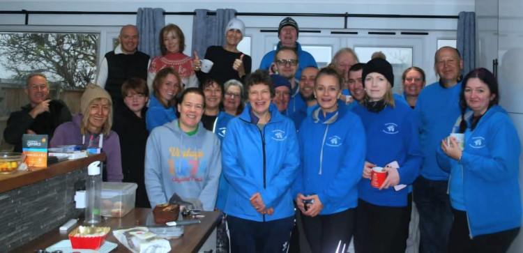 Runners and volunteers warmed up after the event. 