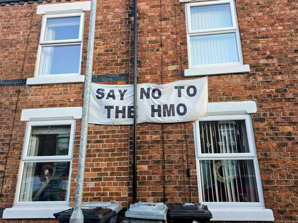 A banner in protest of the proposed 10-bed HMO development at nearby properties on Vincent Street (Ryan Parker).