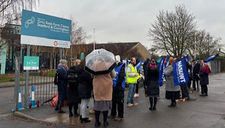 Teachers, union oficials and parents outside the school gates at Gable Hall. 