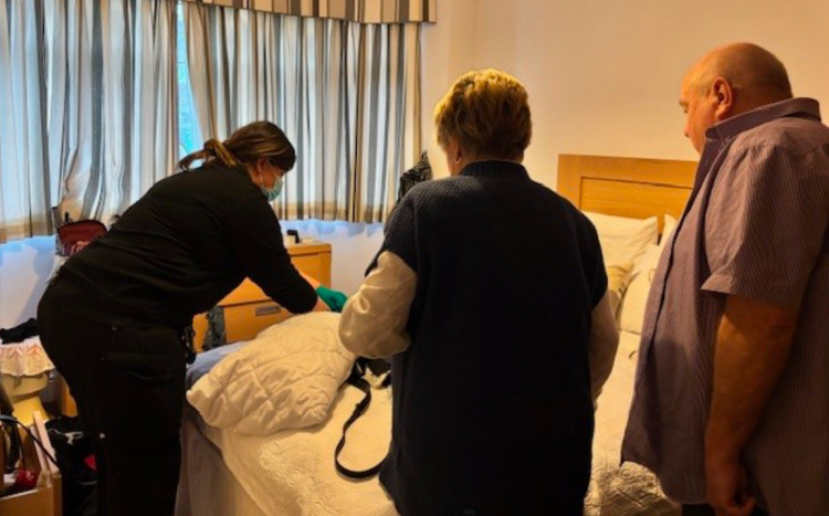 Sharon and Danny Brown With a forensics officer in their bedroom. 