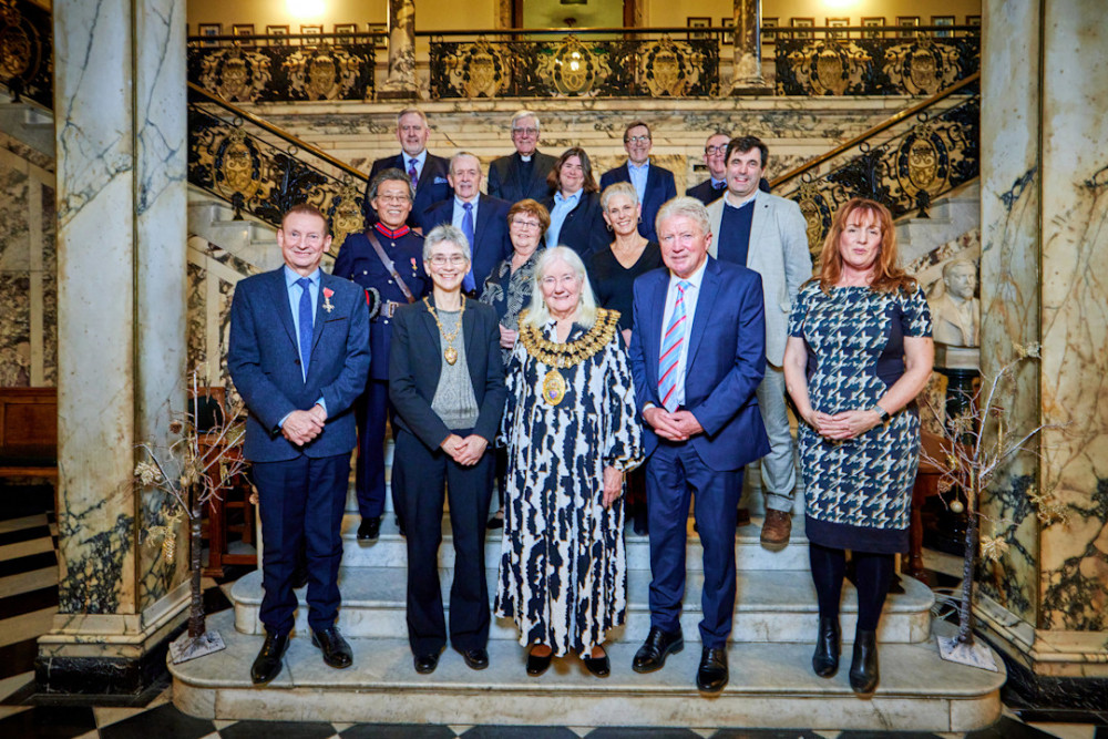 Stockport town hall welcomed the 12 people who were honoured in King Charles III's 2024 honours list (Image - Stockport Council)