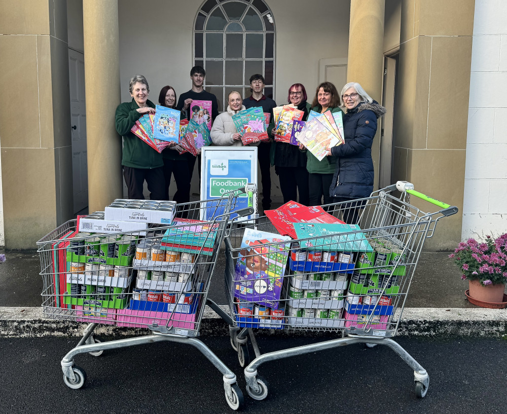 Ashby specsavers staff with items for the foodbank. Photo: Supplied