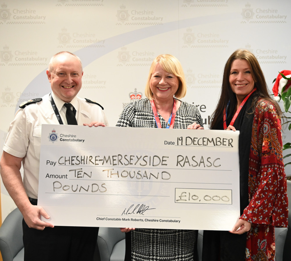 Chief Constable Mark Roberts presents Julie and Helen from RASASC with a cheque for £10,000 (Cheshire Police)