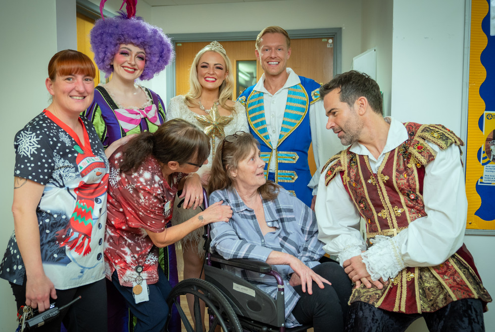 Cinderella cast with Sylvia, who is an inpatient at the hospice, along with healthcare assistant Cheri Deans and housekeeping supervisor Charlie Canning