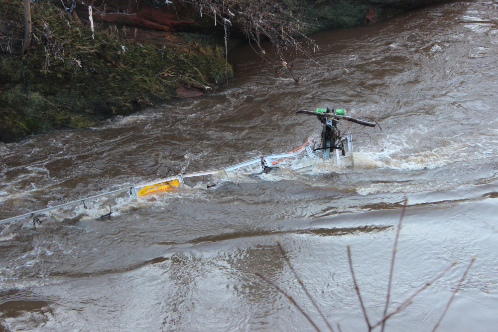 Debris seen in the high-flowing River Mersey following heavy rain and floods (Image - Alasdair Perry)