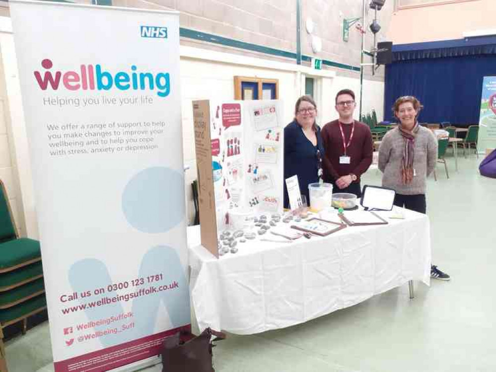 Brandon Lightning, NHS Wellbeing Suffolk advisor, in the middle with colleagues at Shotley Village Hall before lockdown started