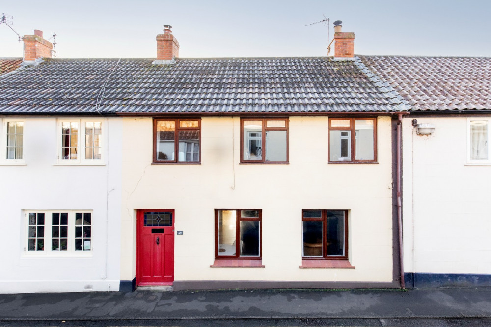 The spacious, period townhouse on West Street, Axbridge, offers stunning views and a charming south-facing garden.