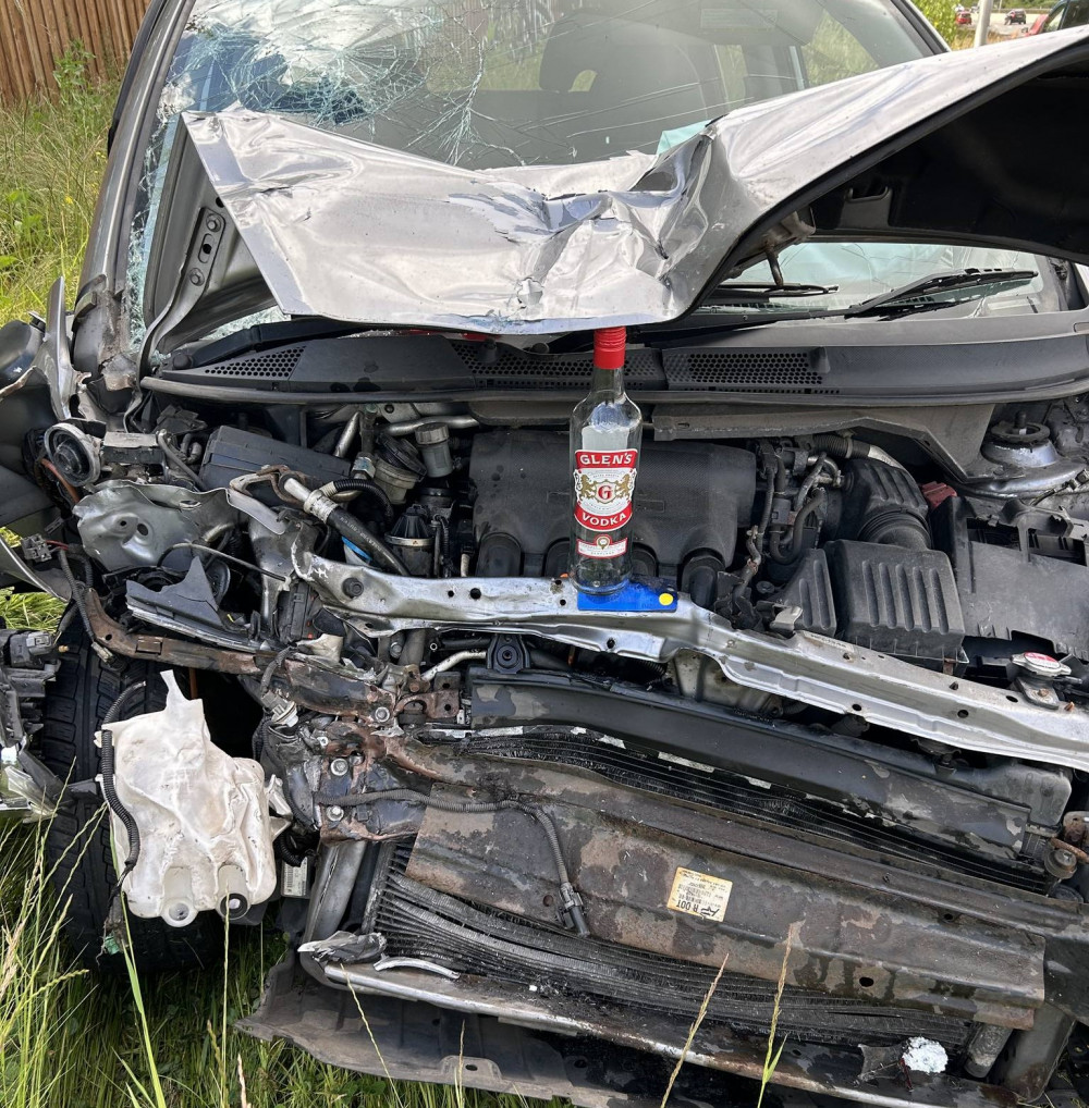 Police found a bottle of vodka in the wreckage after the crash (image via Warwickshire OPU)