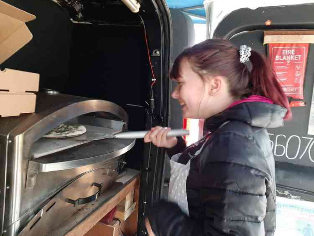 Freya Ewart preparing pizza