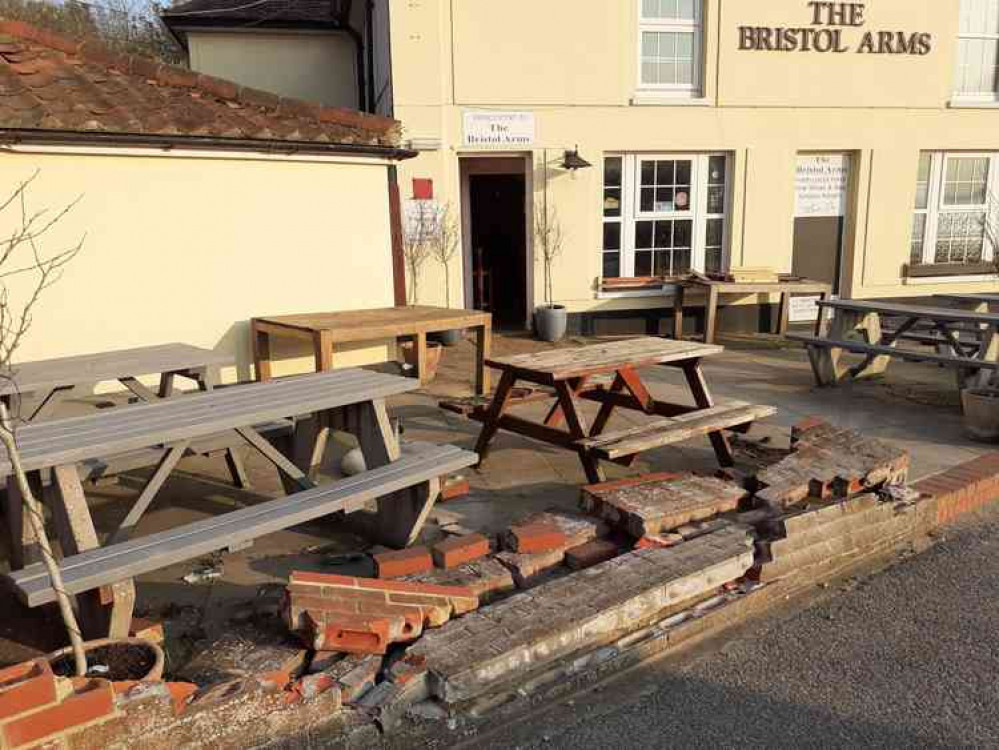 Bus destroyed pub wall