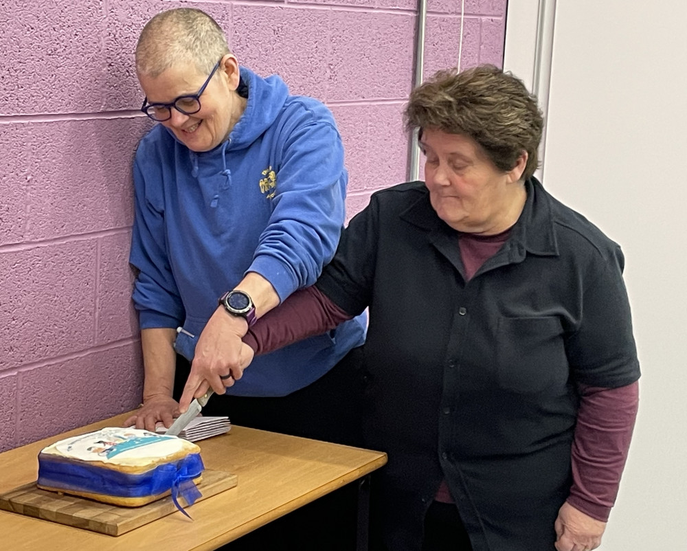 Manager Sarah and Trustee Jackie cut the celebration cake (image supplied)