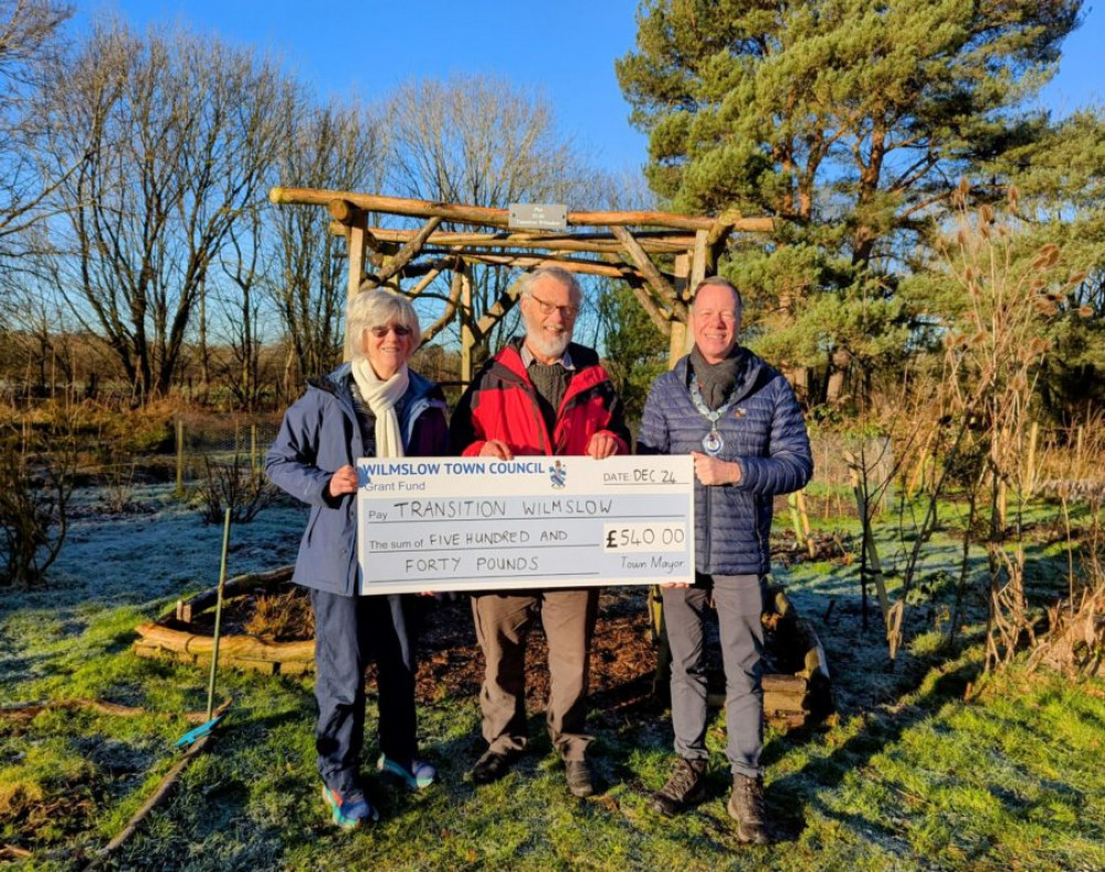 Althea Wilkinson (Manager of the Forest Garden at Land Lane Allotment, on behalf of Transition Wilmslow), Andrew Backhouse (Transition Wilmslow Chair) and Wilmslow Town Mayor, Councillor Tim Higgins (pictured left to right)(Image-supplied).