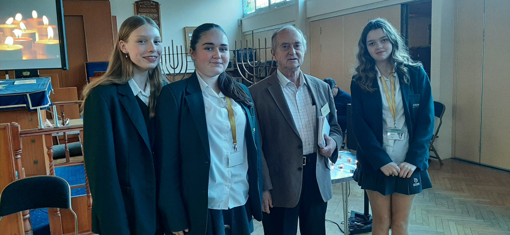 Survivor Marcel Ladenheim (85, hidden child in France) with three girls from Coombe Girls’ School, New Malden, Surrey, at KSDS on Monday 20 January 2025 (Image Supplied)