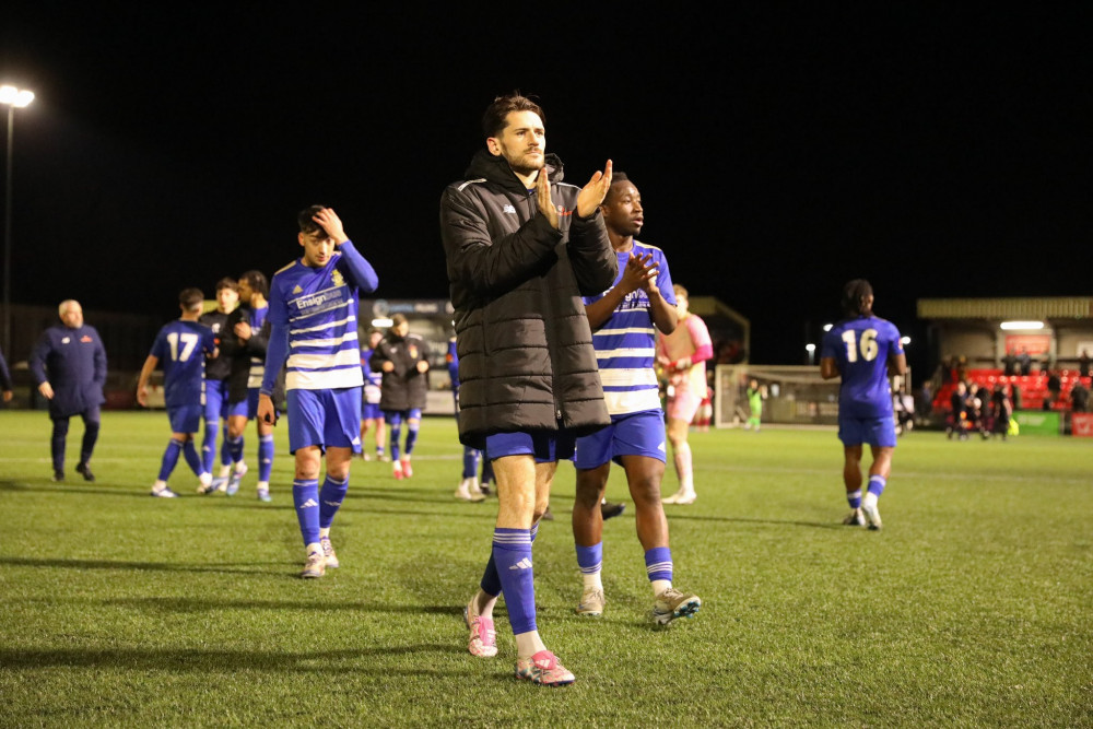 Millers applaud their travelling fans at the end. Aveley celebrate. Picture by Tiego Grenho