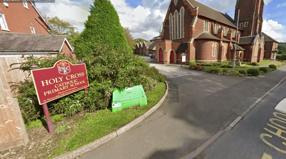 Holy Cross Primary School - with the Bell Tower in the background. Photo: Instantstreetview.com