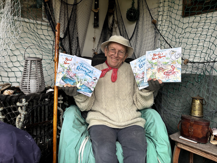 Peter Butler, alias Barnacle Boppy, in the Fisherman’s Hut he has built in his Wells garden to write children’s stories with some of his books