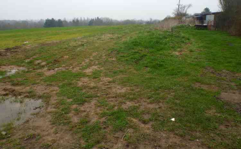 Field which will be home to garages with electric charging points