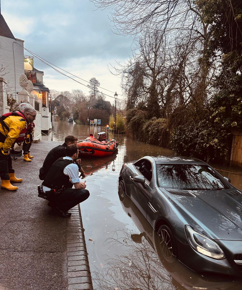 The driver got stuck in a flooded road alongside the White Swan pub in Twickenham (Credit: Anonymous)