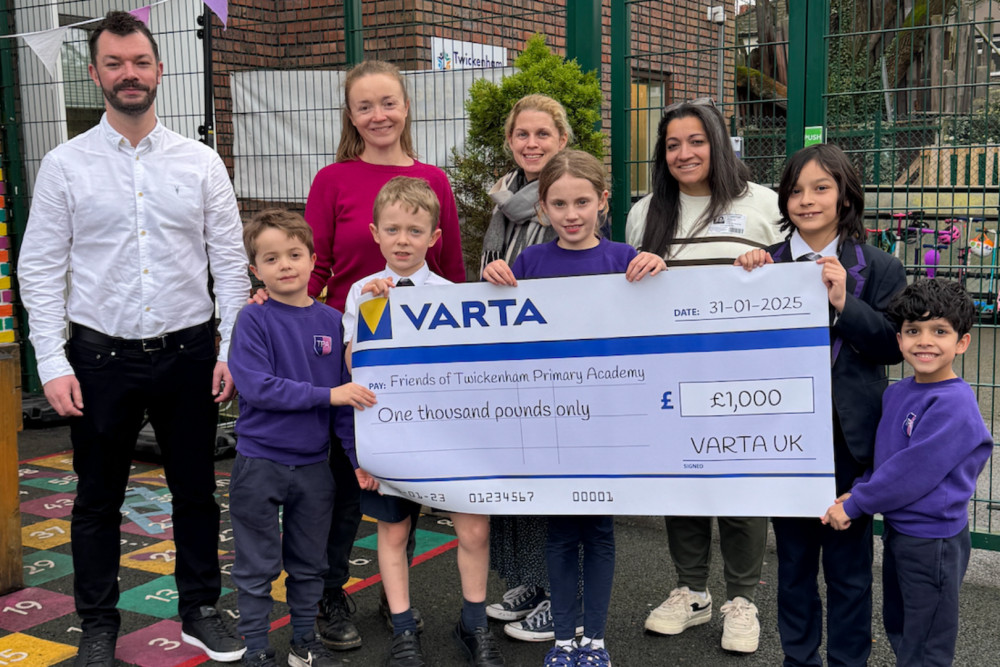 Left to right - Simon Laidler from VARTA with Gemma Wright and Divya Kahlon from Friends of Twickenham Primary Academy, with school pupils (credit: Image supplied).