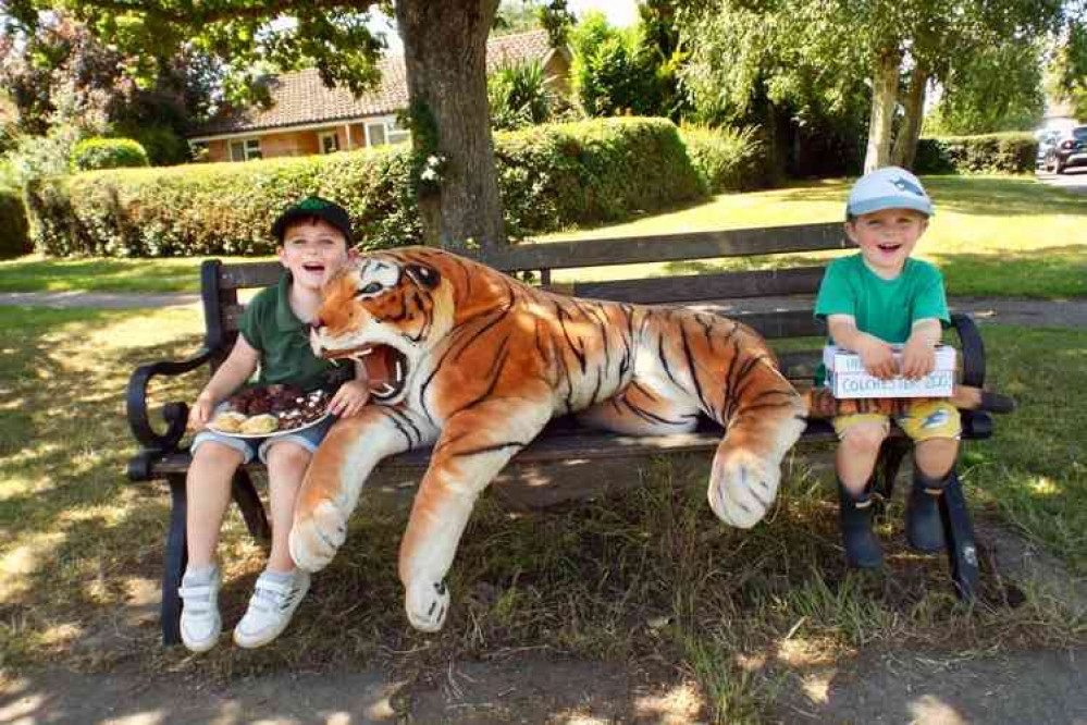 Jack and Henry with cakes, Tiger and donations.