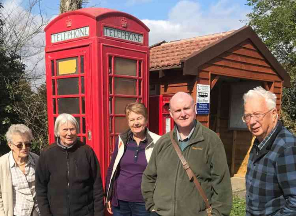 Joanna Standeven, Pauline Ewart, Jane Kirk, Bruce Martin from the Suffolk Archive office and Mike Ewart.  Photo taken before work was done on red phone box