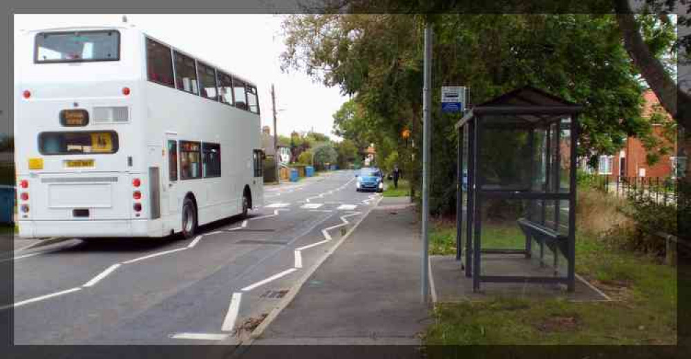 A parent stops of the zig zags of the pedestrian crossing