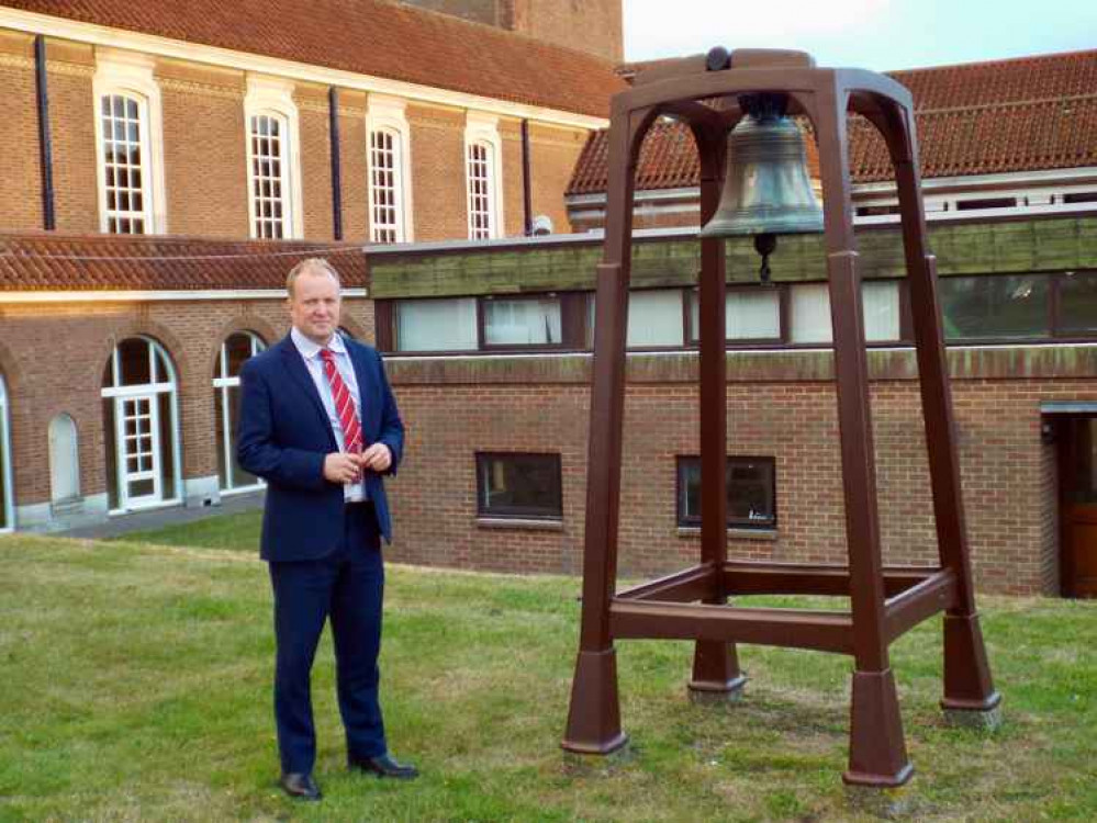 Simon Lockyer next to the old fire bell