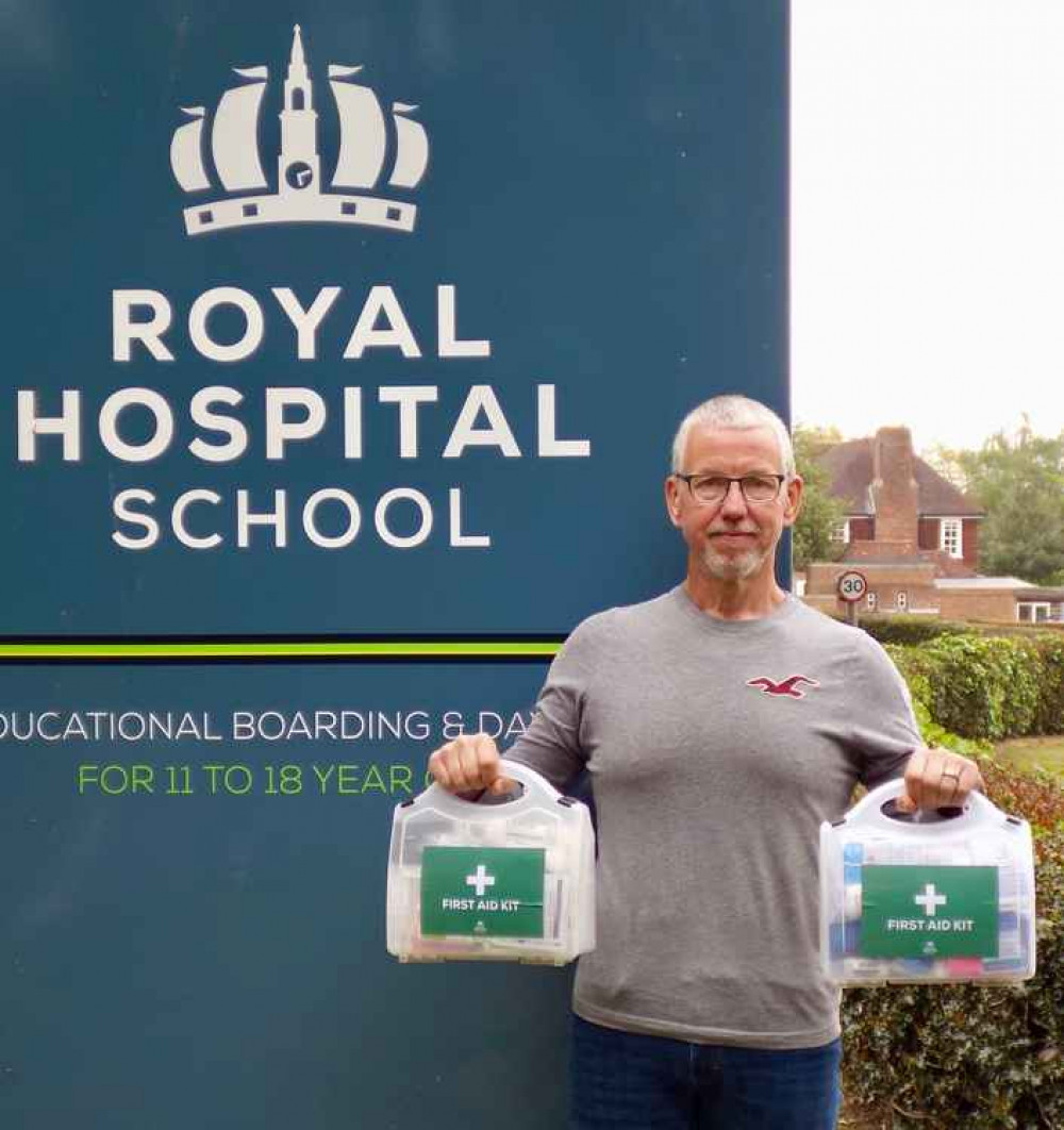 Gary Edwards with first aid kits for park runs sponsored by RHS