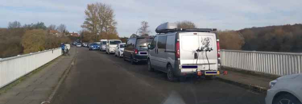 Cars parking illegally along bridge