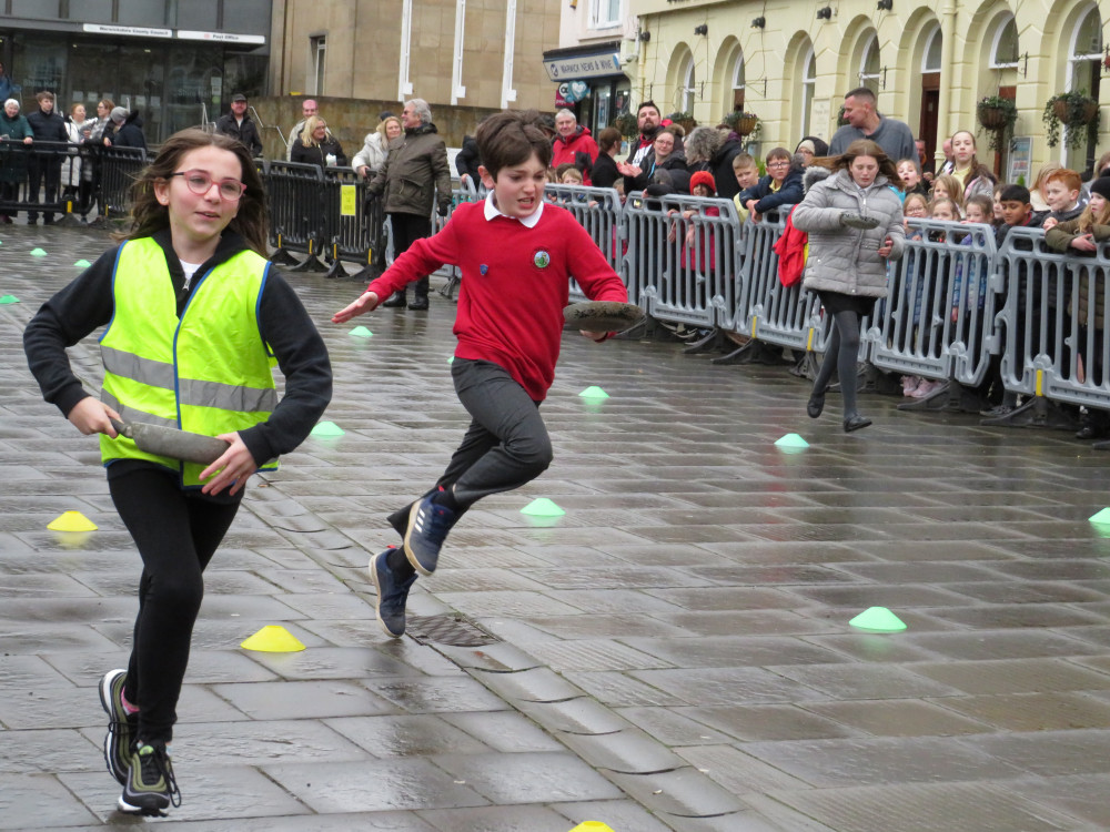 Warwick's annual pancake races include races with the local primary schools (image via Rotary Club of Warwick)