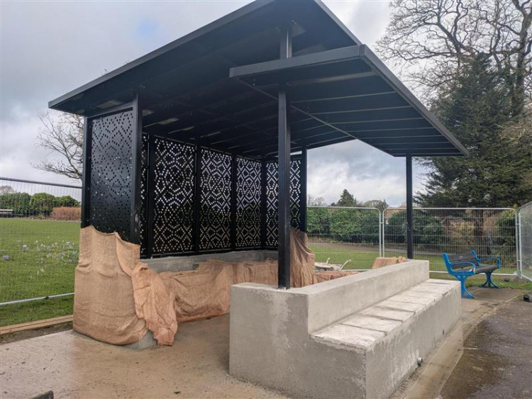 Shepton Mallet Town Council invites residents to Collett Park's new shelter opening on Sunday at 10:30 AM, featuring model boats and refreshments.