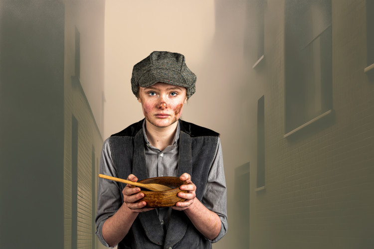 Brave at heart and lost in a cruel world - Oliver (played by Alannah Harris) takes centre stage in the Talisman Youth Theatre’s production of Oliver Twist: The Play (image by Gwyn Davies)