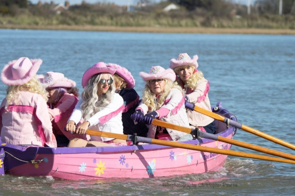 Sailing in style! One crew enjoys a paddle in the sunshine. (Credit: Chris Paul Bourne / KEBS Pictures) 