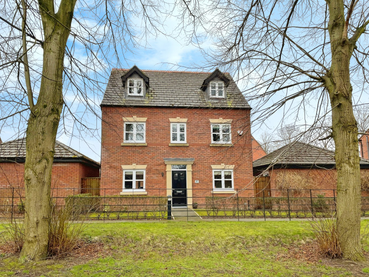 This superb family home overlooks a small wooded area (Image via: Thornley Groves)