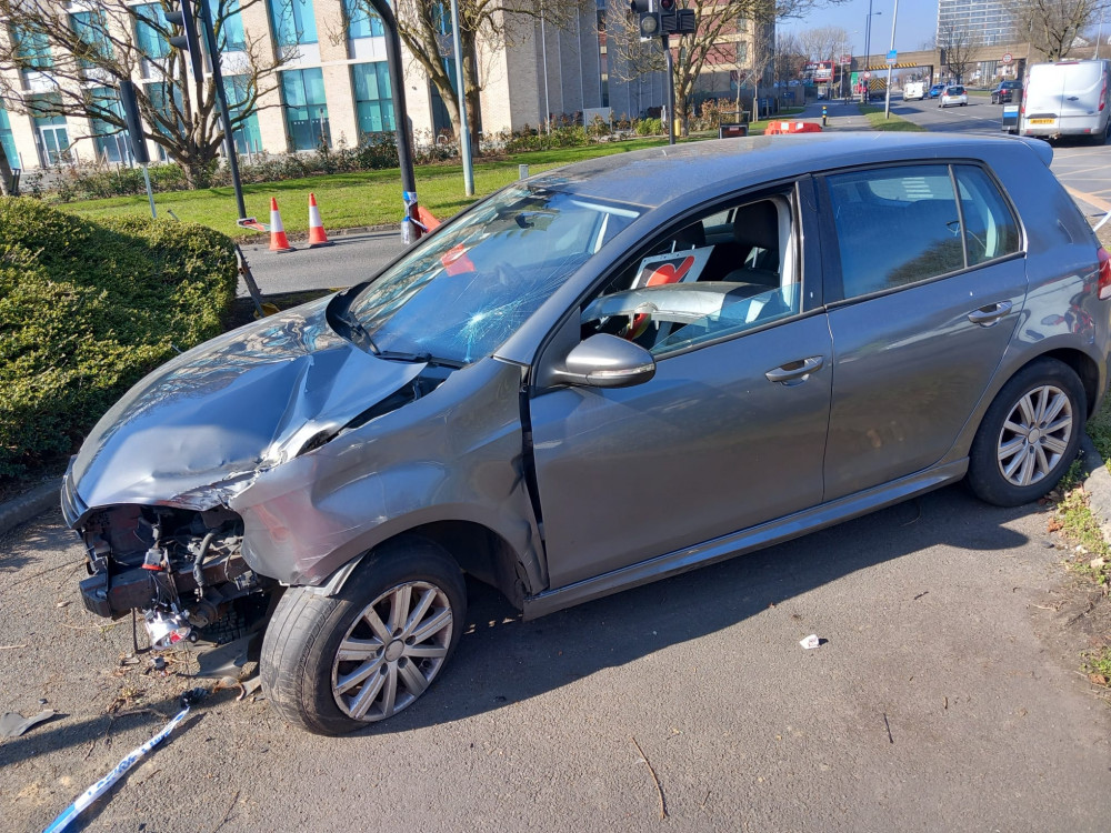 An abandoned and wrecked car on Kingston Road in Tolworth is causing chaos (Credit: Kingston Cycling Campaign)