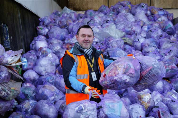 Cllr Michael Wyatt with the purple collection bags filled with flexible plastic and wrapping. Photo: NWLDC