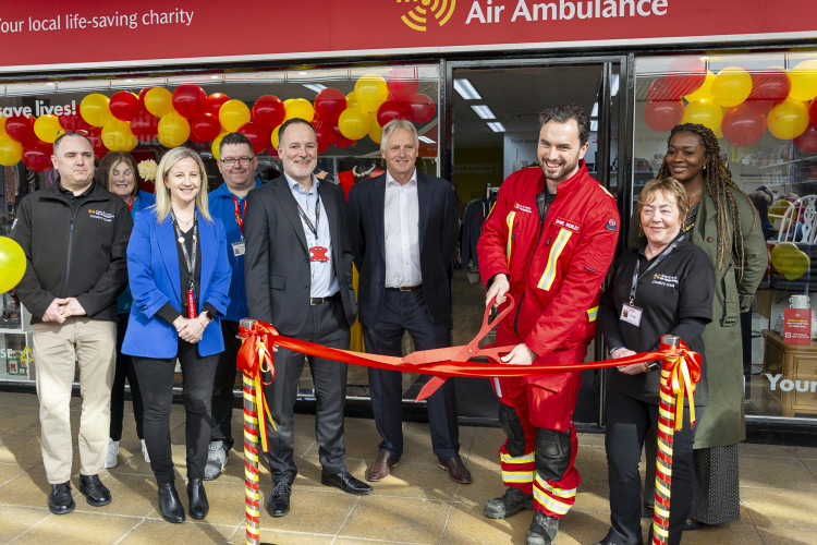 EHAAT's Dr Dan cuts the ribbon to officially open the shop