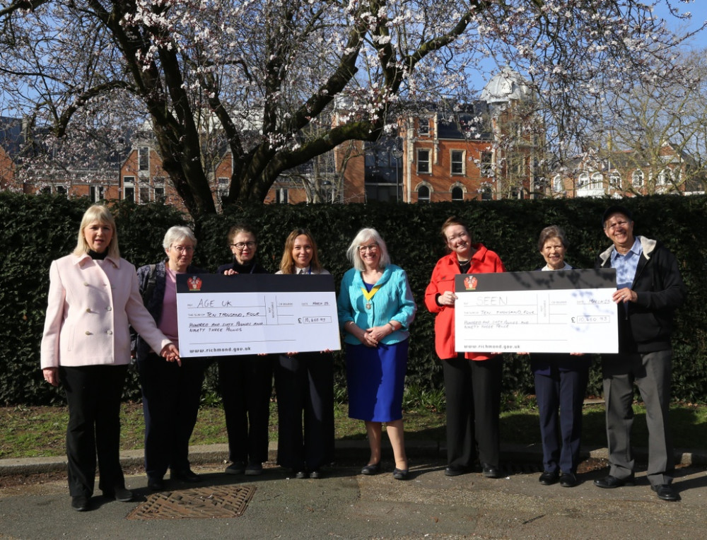 Former Mayor of Richmond upon Thames, Cllr Suzette Nicholson (left) and Cllr Fiona Sacks (middle) presenting cheques to the selected Mayoral charities for 2023/24 (credit: Richmond Council).