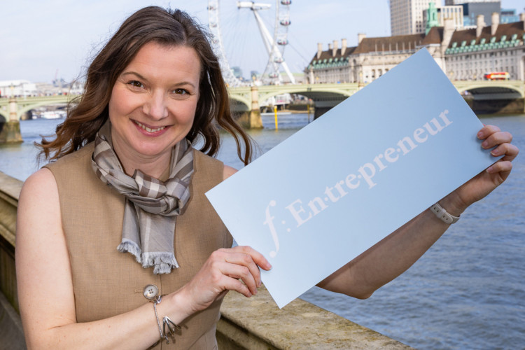 Valentina Rebeschini holding the f:entrepreneur sign in the House of Lords terrace (credit: Image supplied).