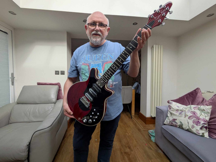 Mick Hoole, who is featured in a new book out about Queen, with his copy of a Sir Brian May guitar. (Photo: Nub News)