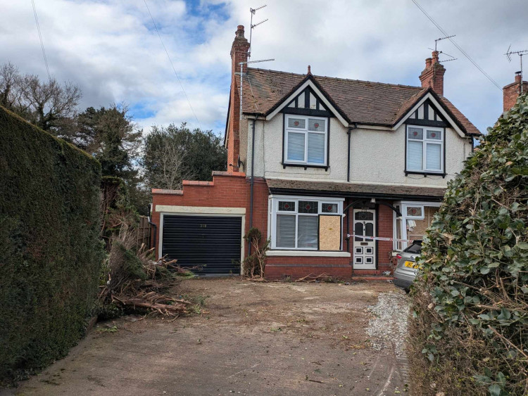 Enquiries are continuing after a car went through a hedge and crashed into a house in Middlewich Road, Sandbach. (Photo: Nub News)