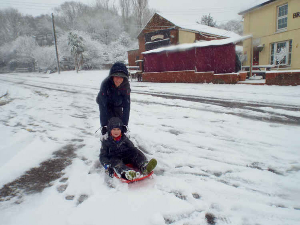 Stuart Harper with son Joshua making the most of the snow