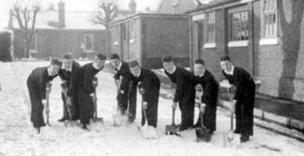 Boys clearing snow Ganges 1955